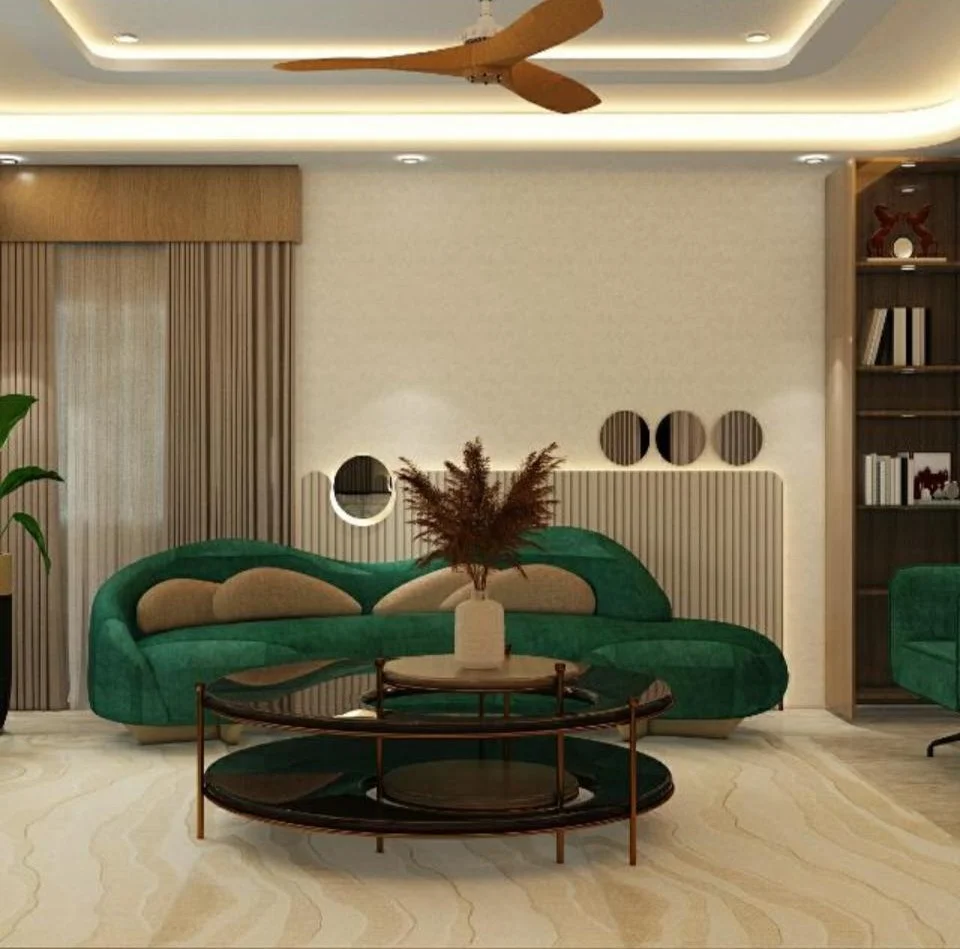 Modern living room with green velvet sofa, round coffee table, and ceiling fan.