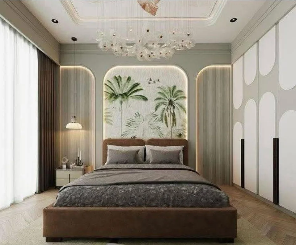 Modern tropical bedroom with palm tree wallpaper, brown bed, and cloud chandelier.